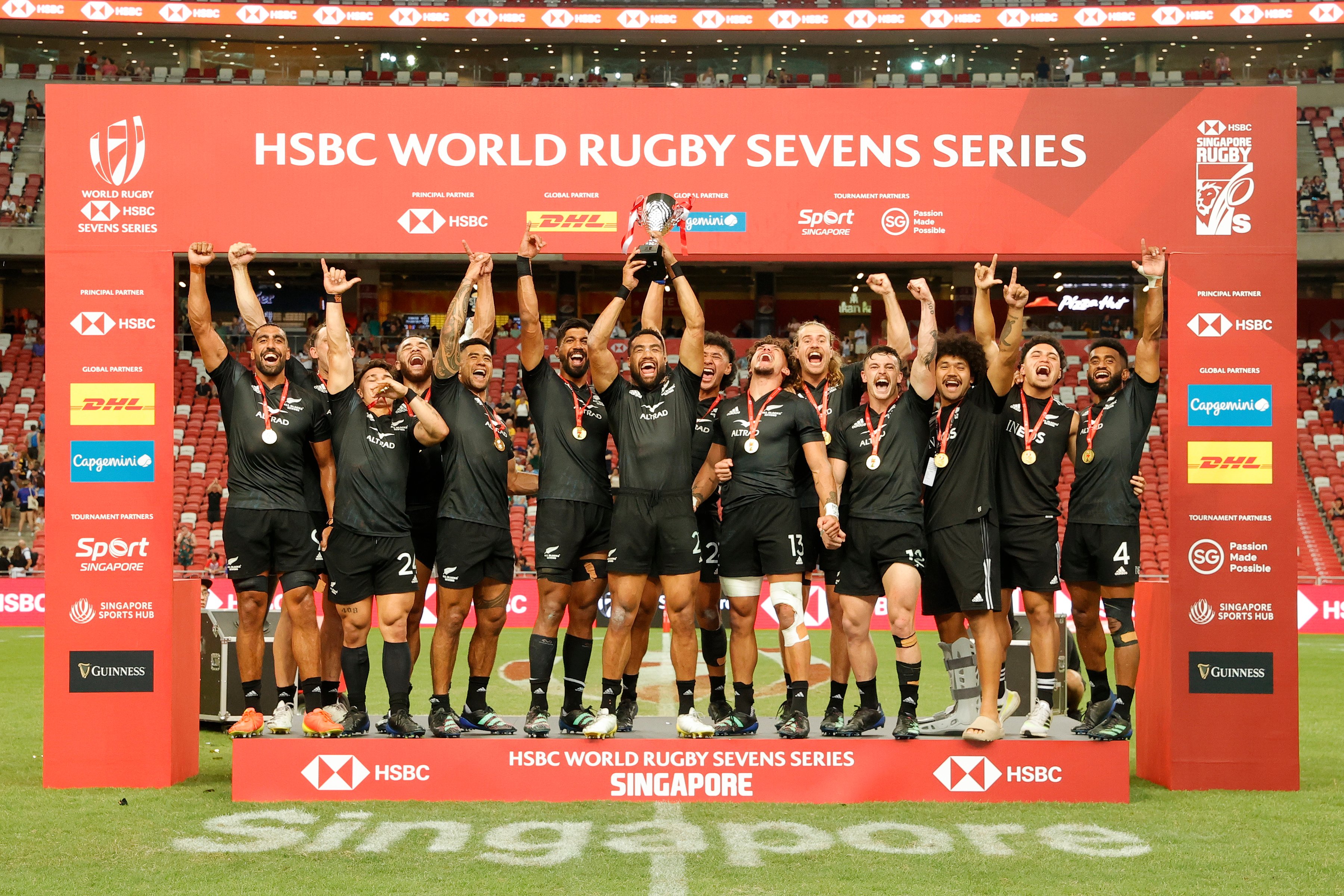 New Zealanders Lift HSBC Singapore Rugby 7s Trophy To Qualify for Paris